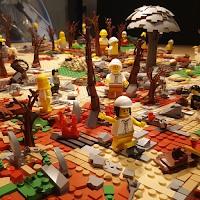 Image by Sheila Webber using Midjourney of lego figures in a highly coloured landscape