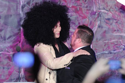 Cher greets Chaz with a hug