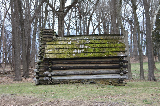 Log hut at Valley Forge covered with moss