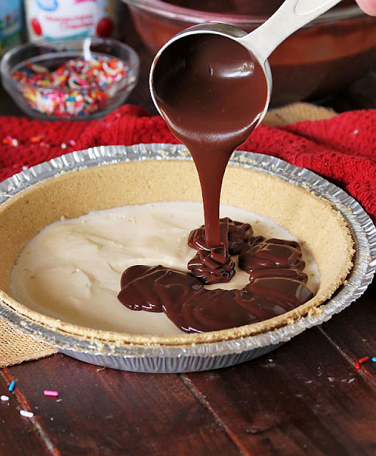 Making Frozen 7-Layer Banana Split Pie Chocolate Sauce Layer Image