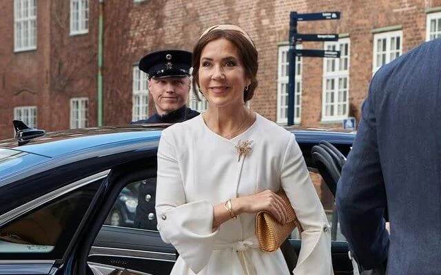 Crown Princess Mary wore a light crepe wool wrap coat by Australian luxury designer Kitx. Gianvito Rossi Ellipsis nude python pumps