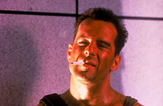 John McClane - O Homem Impossível de Ser Parado e Duro de Matar.