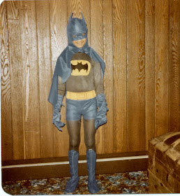 thin boy in Batman costume