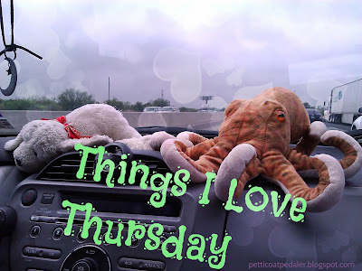 A plushie dog and octopus sitting on the dashboard of a car.  Text reads: Things I Love Thursday