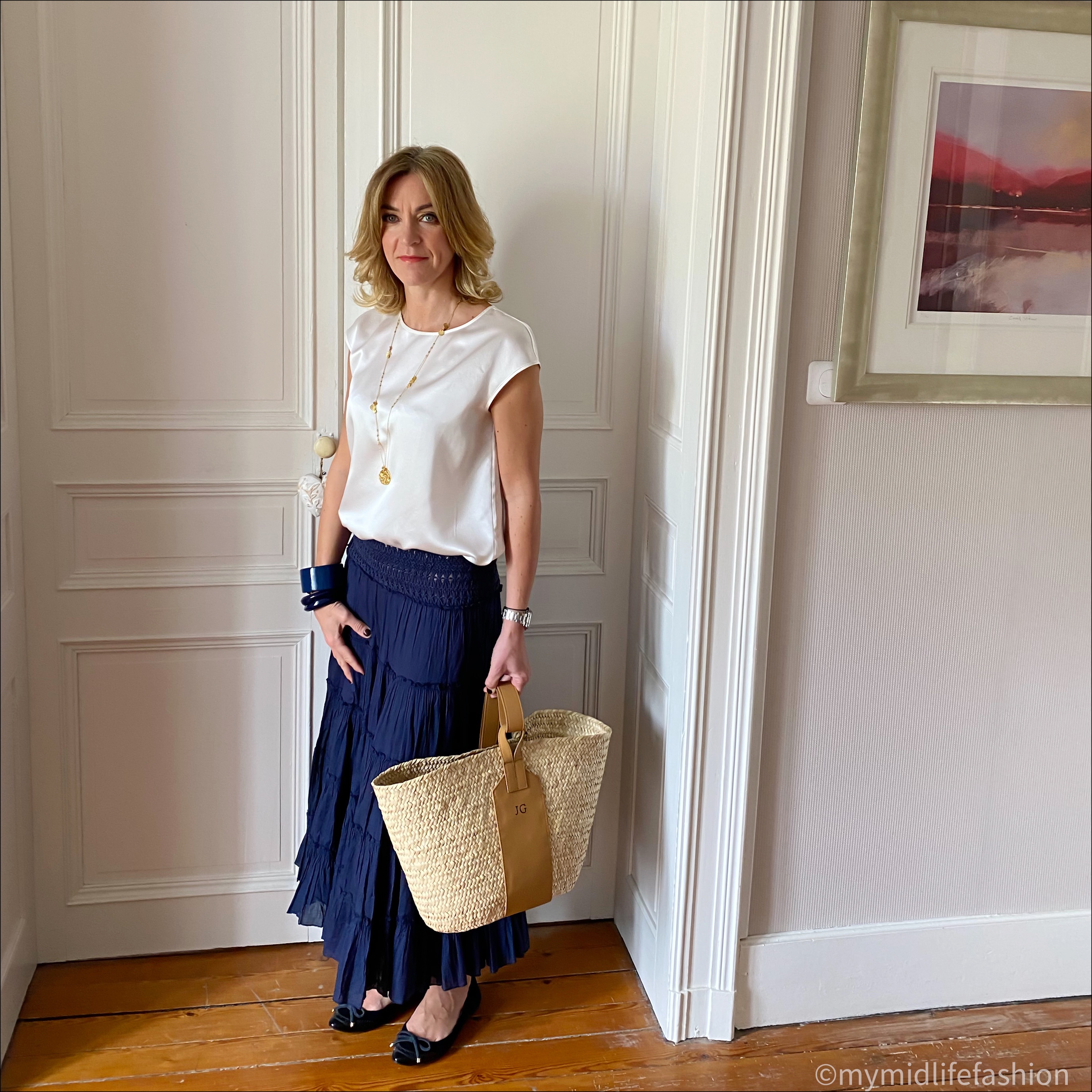 my midlife fashion lily silk basic casual sleeve silk tee, navy tiered maxi skirt, raefeather grace monogrammed straw basket, Burberry ballet pumps