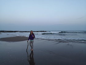 Girl on the beach at sunset