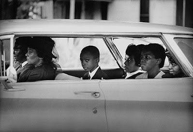 Family in car going to funeral: The Chaney family as they depart for the burial of James Chaney, Meridian, Mississippi, August 7, 1964