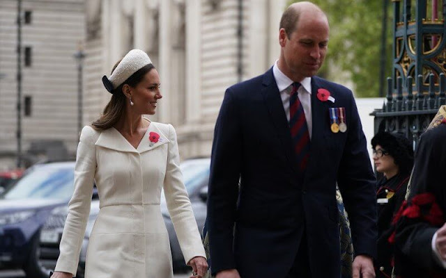 Kate Middleton wore an ivory coat dress by Alexander McQueen. Jenny Packham Roxy clutch. Jane Taylor Calypso halo headband