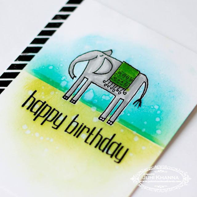 Close up of one layered card with masking, partial stamping and ink blending using stamps from Happy Little Stampers