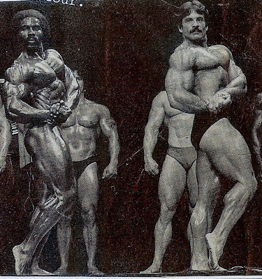 ROBBY ROBINSON AND MIKE MENTZER - POSE DOWN Read about RR's training and life experience, about other legends  of Golden Era of bodybuilding and what really happened  behind the scenes of Weider's empire - in RR's BOOK  "The BLACK PRINCE; My Life in Bodybuilding: Muscle vs. Hustle" -  ▶ www.robbyrobinson.net/books.php