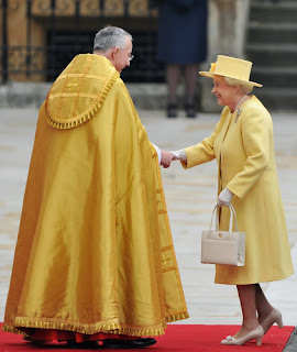 Queen Elizabeth II is greeted by The Right Reverend Dr John Hall, Dean of Westminster as she arrives.