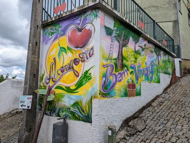 Cherry-themed mural in Alcongosta Portugal on a Castelo Branco day trip