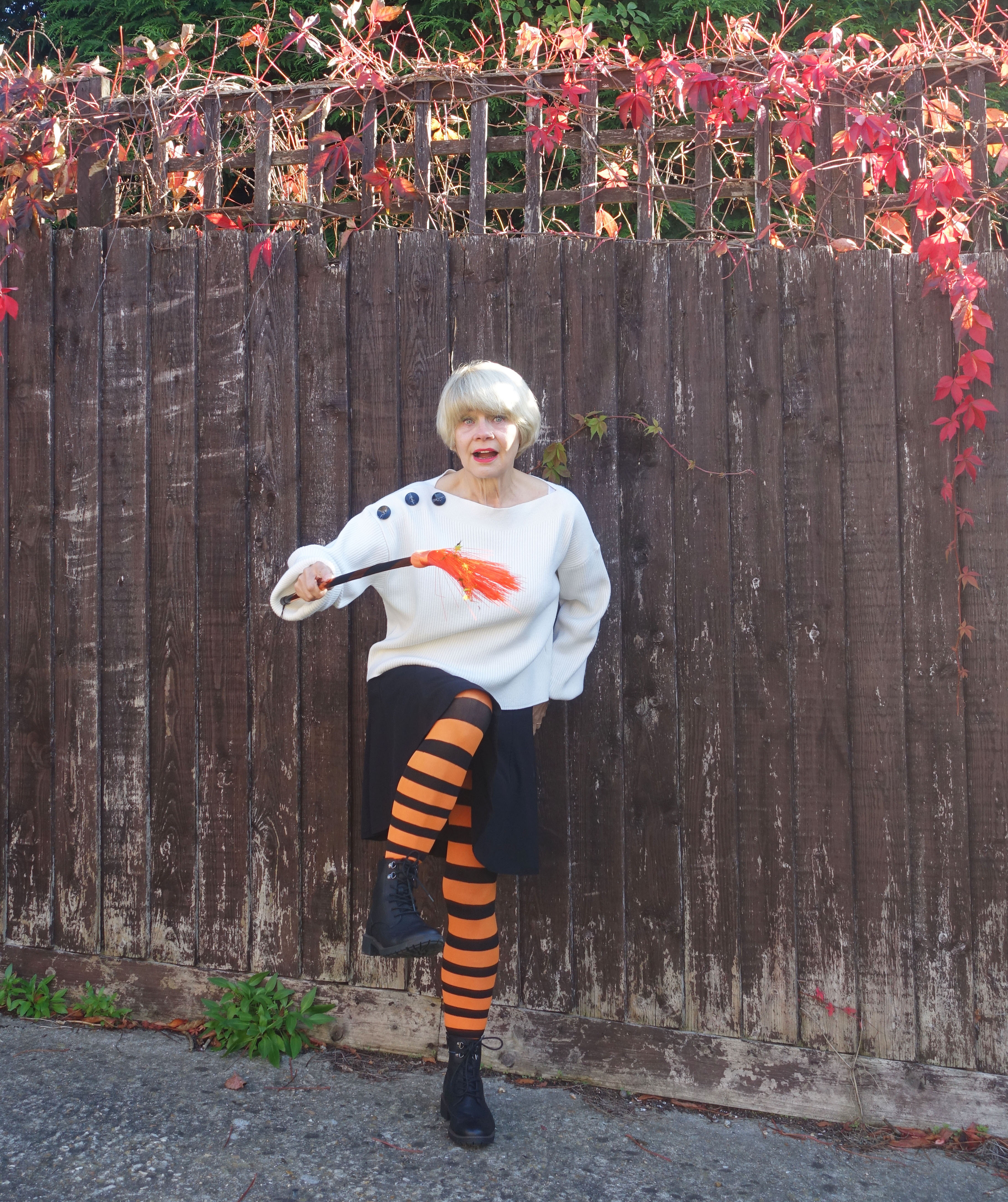 Taking a comedy spin on this month's Style Not Age Challenge, Is This Mutton's Gail Hanlon, who has hardly any orange, wears black and orange striped tights and brandishes a child's orange broomstick