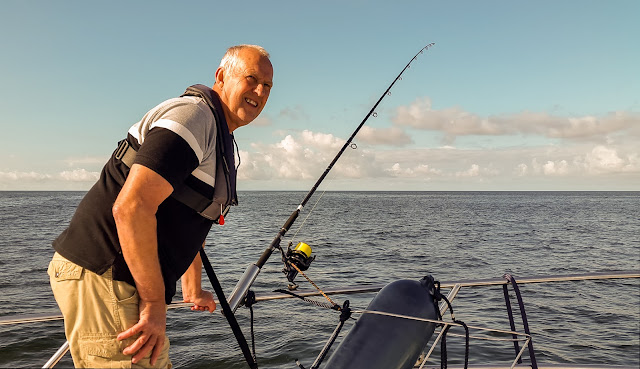 Photo of Phil checking one of his fishing rods