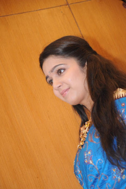 Tollywood actress Charmi in a beautiful blue traditional saree.