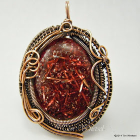Handmade wire wrapped copper pendant with red orgonite cabochon. ©2014 Tim Whetsel