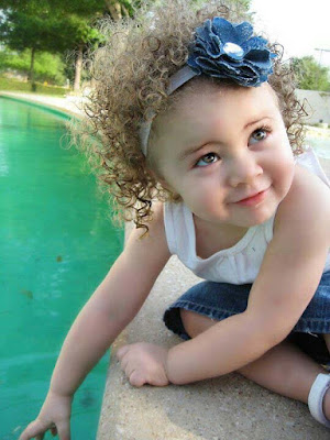 sweetybaby-with-curly-hairs-playing-on-swimingpool-pics