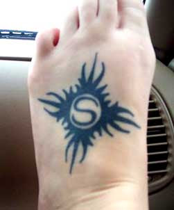 Tribal sun tattoo