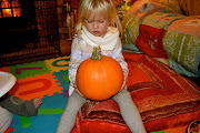 Emilyn tried to help me empty the pumpkin out but she didn't like it at all .