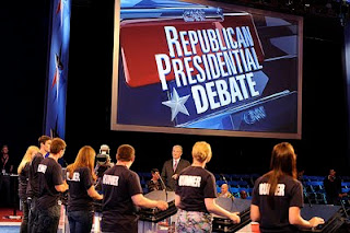 Saint Anselm students stand in on the debate stage