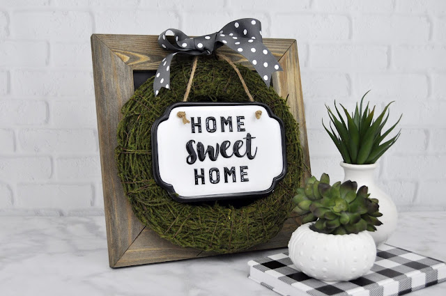 Home Sweet Home Enamel sign on moss-covered wreath. Designed by Jen Gallacher for Jillibean Soup. #enamelsign #wreath #jillibeansoup