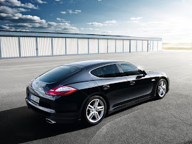 Rear 3/4 view of black 2011 Porsche Panamera parked on tarmac