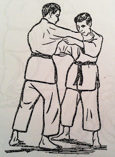 Image of the initial stance of De Ashi Bari. Uke and Tori facing each other in a natural grip.