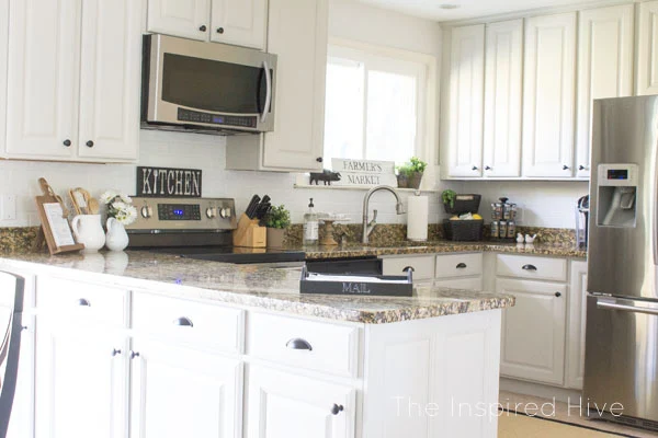 Grey painted cabinets with black hardware