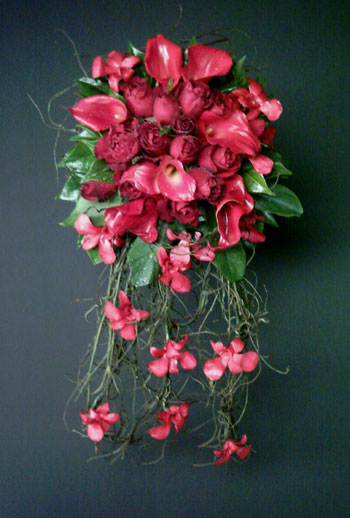 Red roses calla lilies and re orchids cascading wedding bouquet