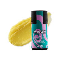 A photo of a black cylindrical tube filled with light green balm with a green label that says magik temple balm lush in white font on a bright background