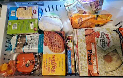 freezer drawer with gluten free bread, gluten free donuts, gluten free waffles, gluten free pizza