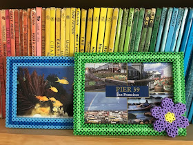 Hama bead photo frames on book shelf