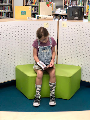 students reading in the library