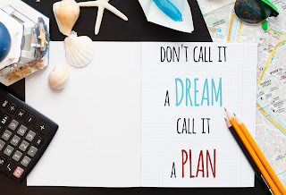 Notebook with a quote "don't call it a dream, call it a plan"