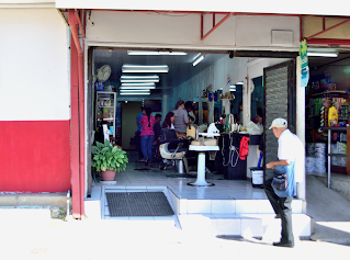 Man stepping into hair salon in Puriscal