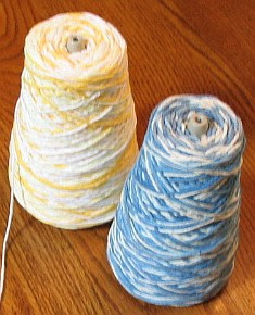 2 cones of Peaches & Creme 4-ply cotton.