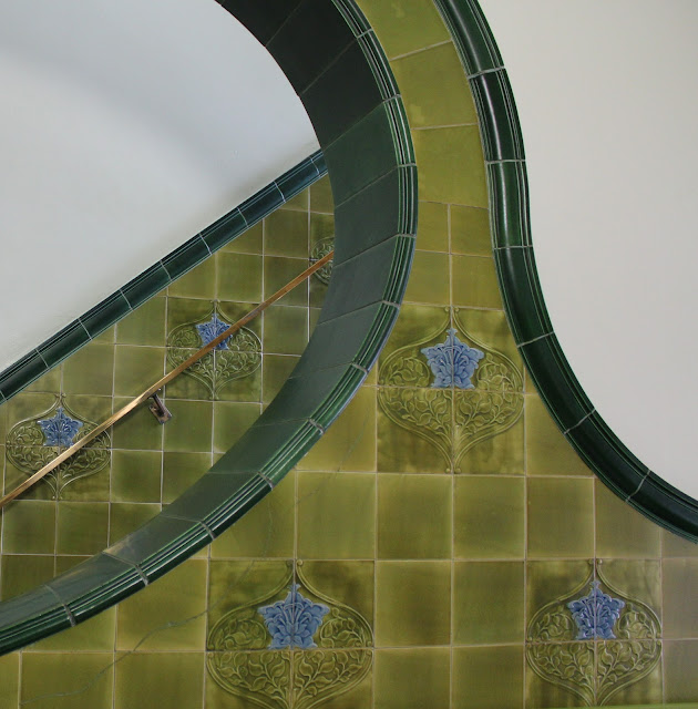 Close up of detail of art nouveau green tiled staircase at Pontefract Museum