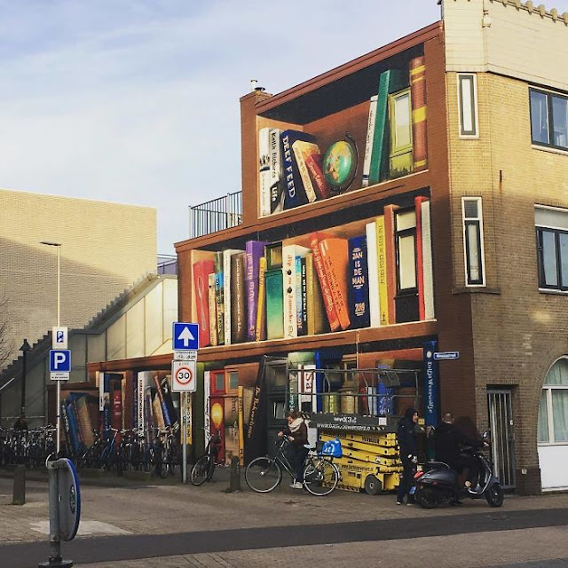 Mix art style, Paint Giant Bookcase On An Apartment Building