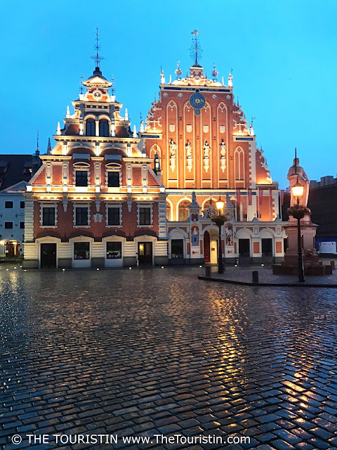 Latvia. House of Blackheads Riga, Early evening, rain. The Touristin