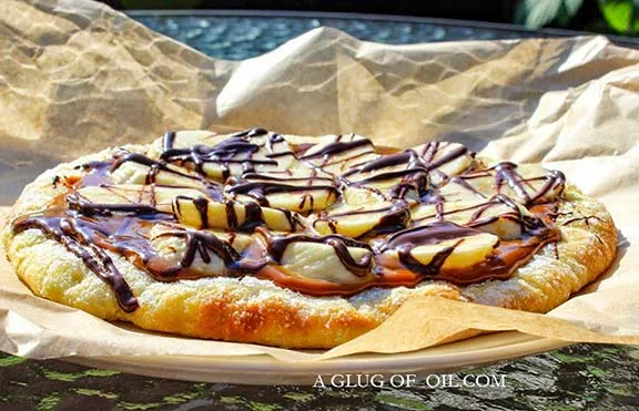 Dessert pizza with chocolate, caramel and banana.