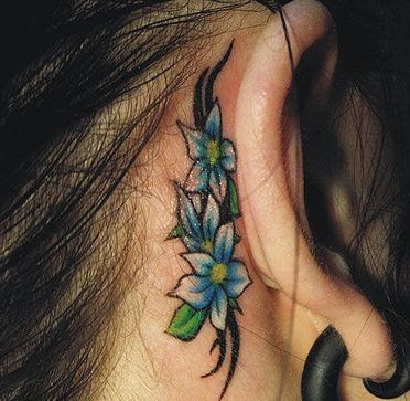 Female Tattoo With Flower Tattoo Design On The Side Neck