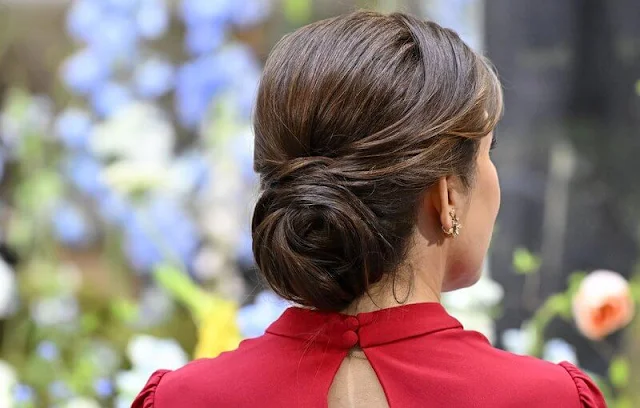 Queen Mary wore a red silk dress by Raquel Diniz, Crown Princess Victoria wore a pink cady dress by Roland Mouret Princess Sofia