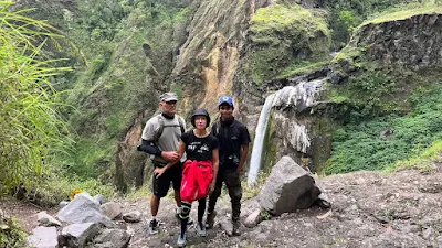 Background Penimbungan waterfall on Torean route Mount Rinjani