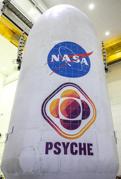 At Astrotech Space Operations Facility in Titusville, Florida, NASA's Psyche spacecraft is encapsulated by the payload fairings of its SpaceX Falcon Heavy rocket...on October 6, 2023.