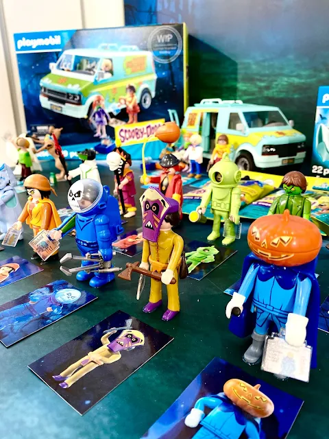 An army of spooky looking Scooby Doo Playmobil characters with the mystery vehicle visible at the back 