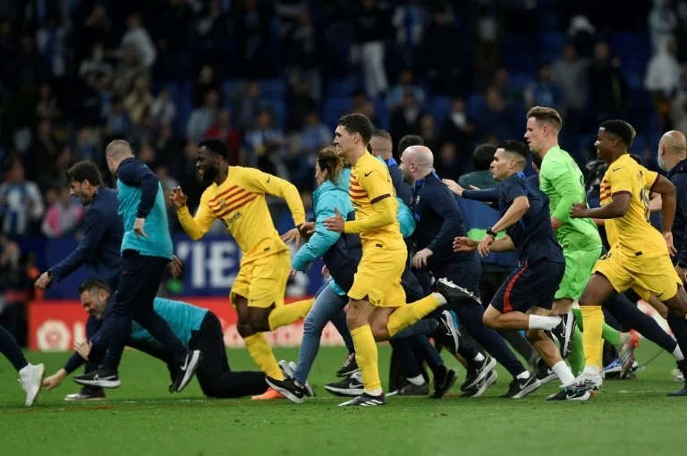 Wild scenes as Barcelona players chased from pitch by angry fans after title triumph