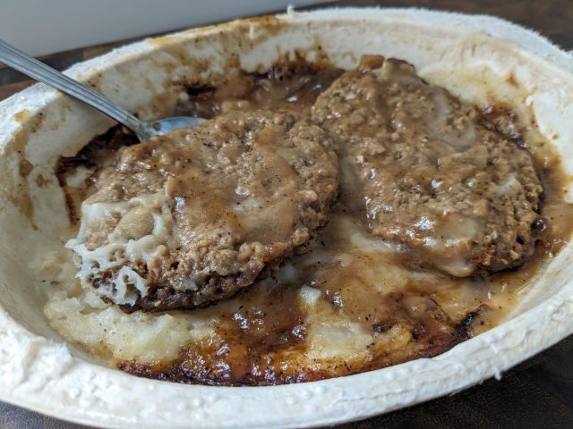 Hungry-Man Smothered Salisbury Steak Double Meat Bowl close-up of patties from top.