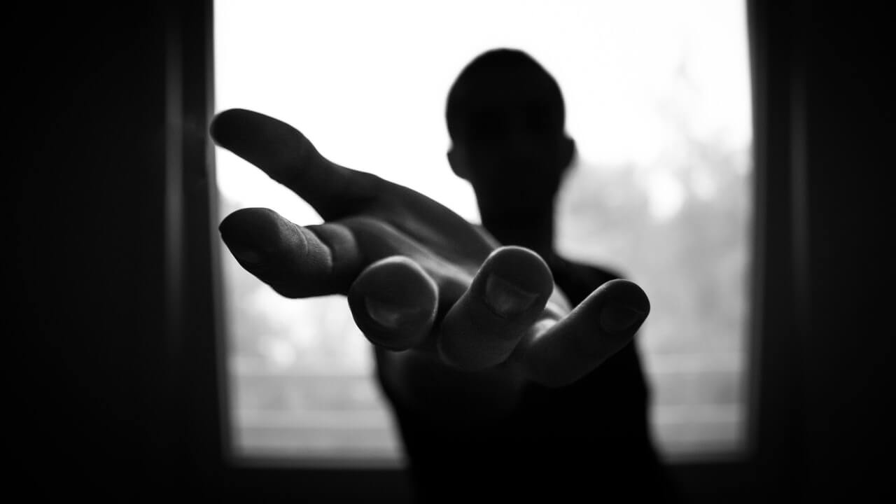 monochrome photo of a man shadow reaching with his hand | Monochromatic Photography In Black And White
