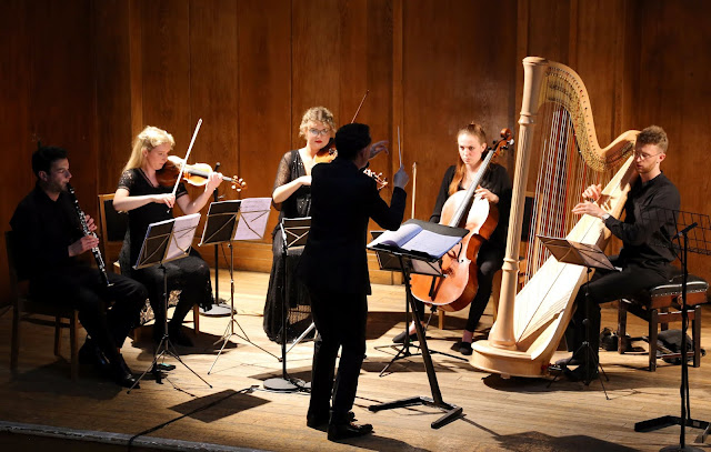 Will Vann conducting the world premiere of Robert Hugill and Joanna Wyld's opera The Gardeners at Conway Hall, 18 June 2019 (Photo Robert Piwko)