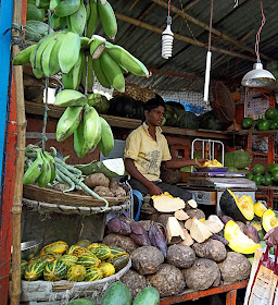  vegetable vendor selling raw banannas